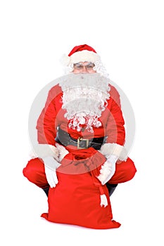 Santa Claus gesticulate while standing straight, isolated over white background. Winter Merry Christmas or New Year