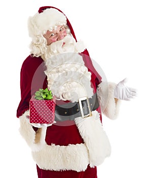 Santa Claus Gesturing While Holding Gift Box