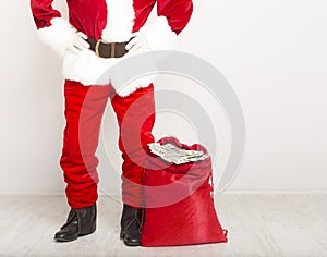 Santa Claus gifting sack full of money for development business