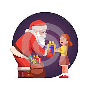 Santa Claus gives gift box to cute little girl kid