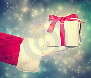 Santa Claus Giving a Christmas Gift