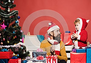 Santa Claus giving a present to a little cute boy