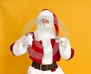 Santa Claus with glass of milk and ginger biscuit photo