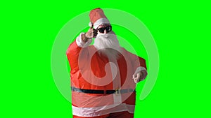 Santa Claus on a green background makes thumbs up and thumbs down gestures.