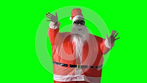 Santa Claus on a green background waves in front view.