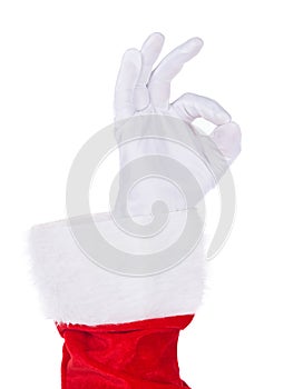 Santa Claus hand showing Okey gesture isolated on white