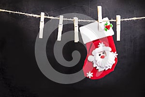 Santa Claus hanging on a wooden clothespin rope