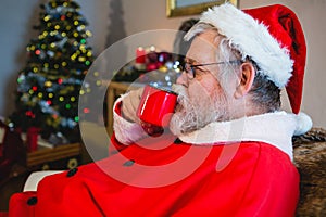 Santa Claus having coffee