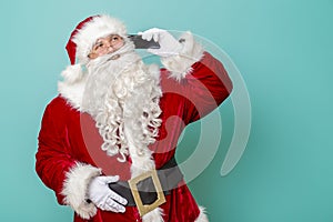 Santa Claus having a phone conversation