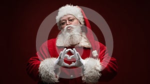 Santa Claus with heart sign