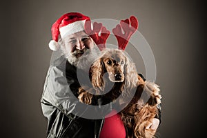 Santa Claus with his dog as Rudolph