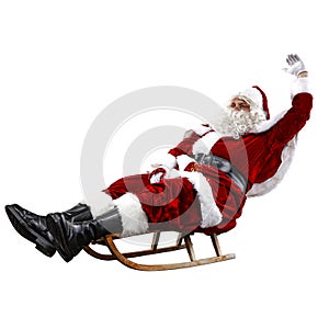 Santa Claus on his sleigh with a sack with presents. Winter snowy day with white snow.