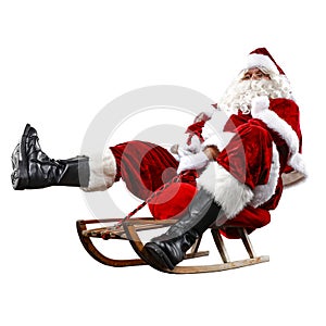 Santa Claus on his sleigh with a sack with presents. Winter snowy day with white snow.