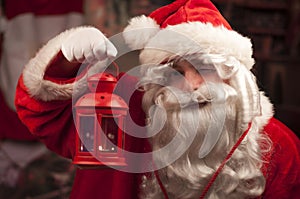 Santa Claus holding Christmas lantern