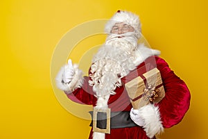 Santa Claus holding Christmas present