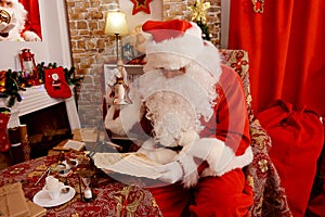 Santa Claus holding Hand bell and musical manuscript, music sheet