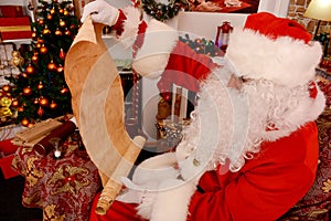 Santa Claus holding old scroll of parchment,