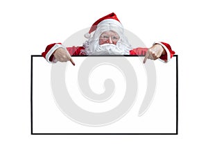 Santa Claus is holding and pointing the white blank sign for seasonal promotion sale and announcement board advertisement isolated