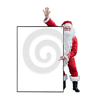 Santa Claus is holding and pointing the white blank sign for seasonal promotion sale and announcement board advertisement isolated