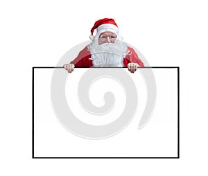 Santa Claus is holding and pointing the white blank sign for seasonal promotion sale and announcement board advertisement isolated