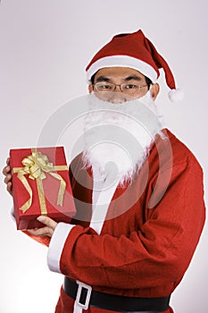 Santa Claus Holding A Present