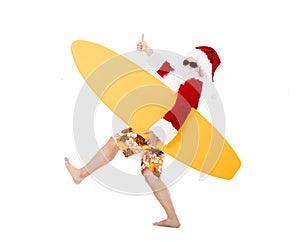 Santa Claus holding surf board with thumb up