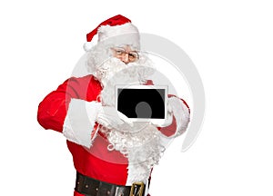 Santa Claus holding a tablet computer.