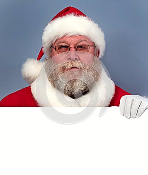 Santa Claus holding white board