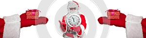 Santa Claus holding a white clock which shows five minutes to midnight. Two hands with gifts on them extended to him. New year`s