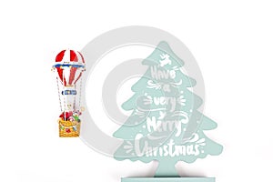 Santa Claus in Hot air balloon flight up to a wood green tree, on white background