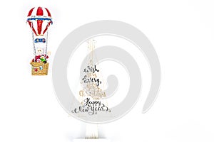 Santa Claus in Hot air balloon flight up to a wood white tree, on white background