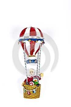 Santa Claus in Hot air balloon flight on white background
