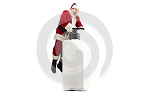 Santa Claus with the huge antiseptics against COVID like Christmas gift isolated on white background