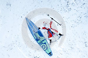 santa claus and an inflatable board with a paddle