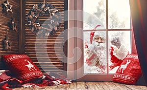 Santa Claus is knocking at window