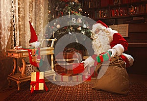 Santa Claus leaving presents under the Christmas tree