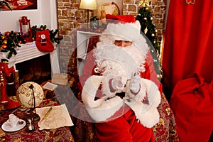 Santa Claus looking at pocket watch