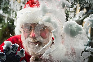 Santa Claus looking through window. Close-up face
