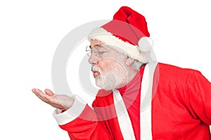 Santa Claus magically blowing