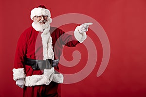 Santa Claus making gestures for a poster on a red background