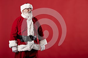 Santa Claus making gestures for a poster on a red background