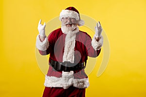 Santa Claus making gestures for a poster on a yellow background