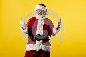 Santa Claus making gestures for a poster on a yellow background