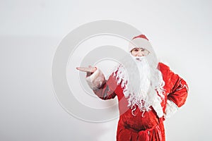 Santa Claus, man in traditional red costume on white background.