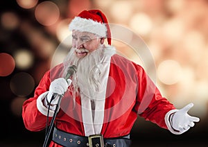 Santa claus with a microphone singing christmas songs