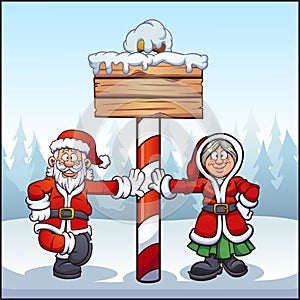 Santa Claus and Mrs. Santa at North Pole with wooden sign