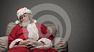 Santa Claus napping on the armchair
