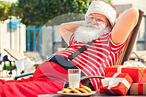 Santa Claus near the pool holiday vacation concept