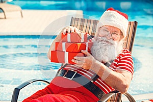 Santa Claus near the pool holiday vacation concept