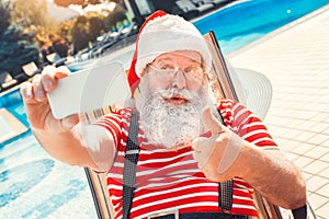 Santa Claus near the pool holiday vacation concept